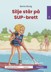 Silje står på SUP-brett